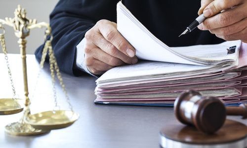 Scales of justice with judge gavel on table Scales of justice with judge gavel on table