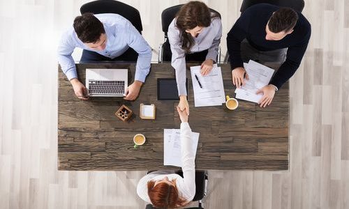 Business People Handshake In Office Business People Handshake In Office