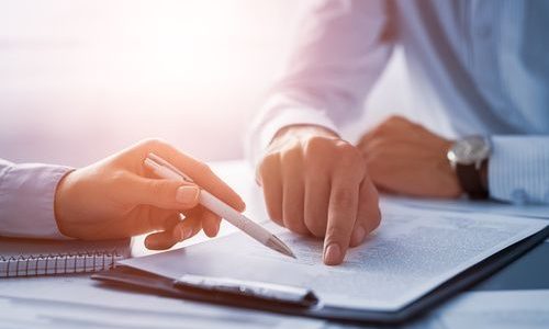 Business people negotiating a contract. Business people negotiating a contract.